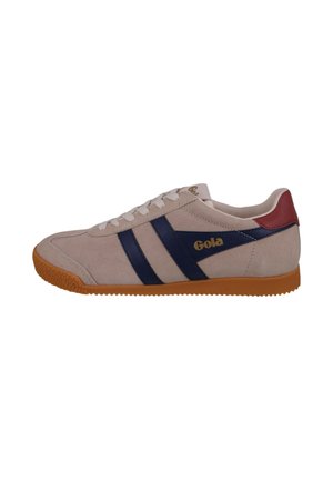 Beige suede Gola sneaker with navy stripes, white laces, red heel patch, and gum rubber sole, shown from the side.