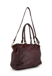 Dark burgundy leather handbag with two sturdy handles, an adjustable strap, brass hardware, and textured finish. Features side pockets.