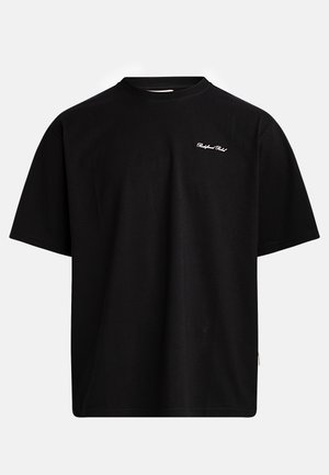 T-shirt en coton noir avec un col rond, des manches courtes et un petit logo blanc sur le devant. Présente une coupe décontractée avec une texture lisse.