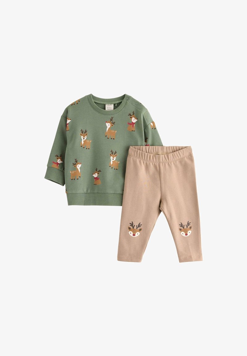 Zielona bluza z nadrukiem renifera i beżowe legginsy z twarzami reniferów. Materiał: miękka mieszanka bawełny. Casualowy, wygodny krój.