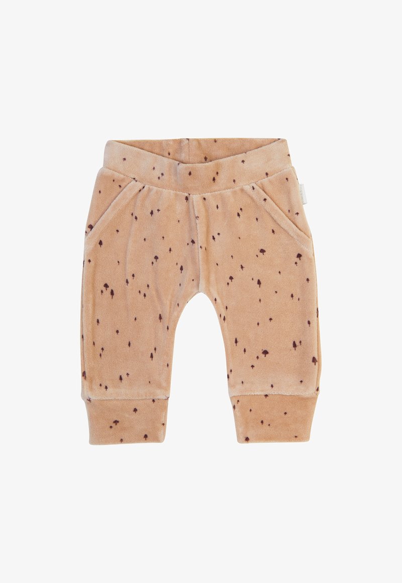 Pantalons doux beiges avec une texture veloutée et des taches brunes éparpillées. Ils possèdent une taille élastique et deux poches latérales.