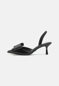 Black heeled slingback shoe featuring a pointed toe, glossy leather material, and a large bow accent on the front.
