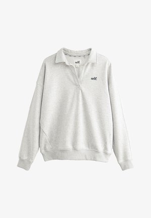 Helehall hall kapuutsiga pusa, millel on väike vasakul rinnal tikitud must logo ning soonilised varrukaääred ja alläär.