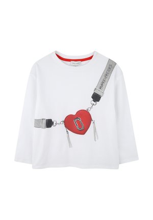 White long-sleeve t-shirt featuring a red heart graphic with metal accents and grey straps, textured with tassels and bold black outline.
