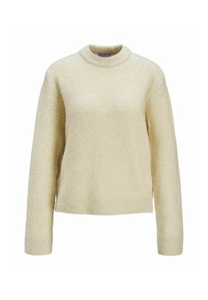 Gai bēšas krāsas adīta džemperis ar garām piedurknēm, apaļu dekoltē un teksturētu apdari. Audums izskatās mīksts un ērts, ar nedaudz saīsinātu apakšmalu.