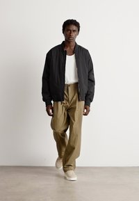 Calvin Klein PLEATED - Trousers - capers