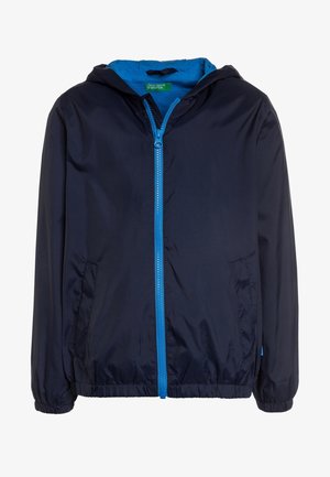Marineblauwe hoodie met een felblauwe ritssluiting, elastische manchetten en zijzakken, gelabeld United Colors of Benetton.