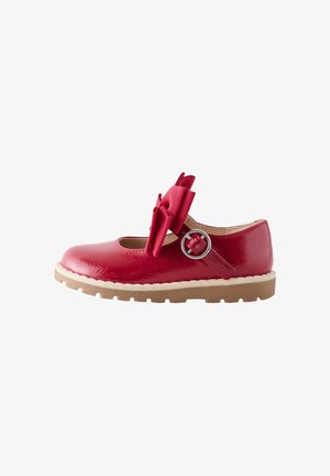 Rode glanzende kinderschoen Mary Jane met een dubbele strik op het bandje en een ronde zilveren gesp, plus een beige rubberen zool met profiel.