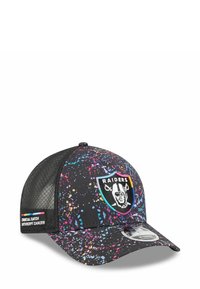 Black cap with a splash pattern in pink, blue, and yellow. Features a Raiders logo and a side tag labeled "Crucial Catch." Mesh back.