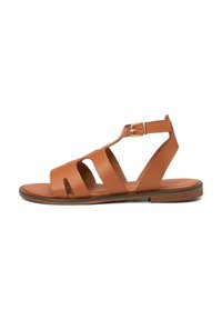 Brown leather sandal with a cutout design, adjustable ankle strap, and gold buckle. Flat sole with minimal texture and smooth finish.
