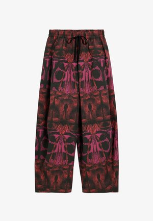 Pantaloni morbidi neri con un vivace motivo astratto in rosso e rosa. Vita elastica con coulisse per una vestibilità regolabile.
