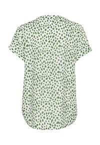 Patterned blouse featuring a white base with green and blue leopard spots, short sleeves, and a rounded hem. Soft, lightweight fabric.