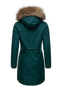 Long, dark teal parka with a faux fur-lined hood, drawstring waist, and button cuffs. Features a rear slit and subtle logo detail.