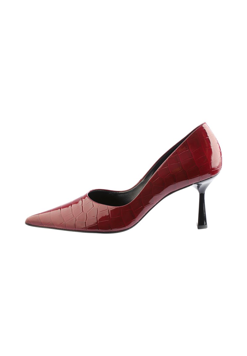 Glossy burgundy high-heeled pump with crocodile pattern texture, pointed toe, and slim black heel isolated on white background.
