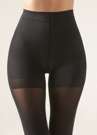 Černé vysoké legíny s texturovaným korzetem a průhlednými částmi nohavic. Mají hladký pas a přiléhavý, bezešvý design.