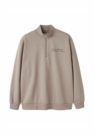 Felpa beige con mezza cerniera, maniche lunghe, polsini a costine e testo "Porte d'Auteuil" con coordinate sul petto a sinistra.
