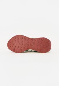 Rubber shoe sole with a textured, grip pattern. Features a red base with raised sections and green accents along the side edges.