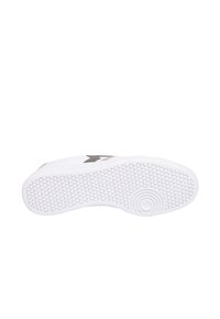 Suola di sneaker bianca con un motivo a nido d'ape testurizzato. Presenta un accento circolare; design minimalista senza marchi visibili.