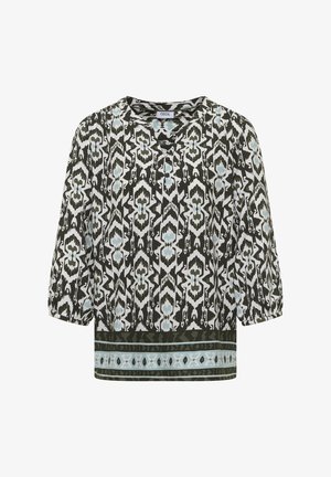 Bluzka z długim rękawem z czarno-białym i niebieskim geometrycznym kwiatowym wzorem oraz dekoracyjnym poziomym paskiem przy dolnym brzegu, okrągły dekolt.