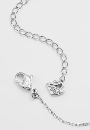 Silver chain necklace with a lobster clasp and a small sailboat charm adorned with three clear rhinestones.