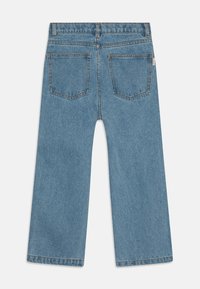 TINYCOTTONS DAISIES - Sirgete säärtega teksad - light blue