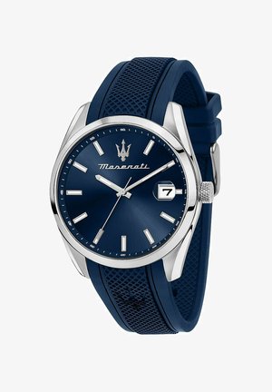 Maserati-Uhr mit einem runden blauen Ziffernblatt, silberfarbenen Markierungen, einem Datumsfenster und einem strukturierten blauen Gummiband. Akzente aus Edelstahl.