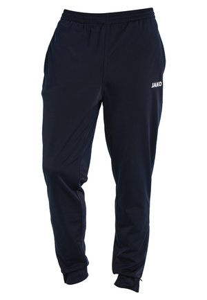 Marineblauwe sportbroek van lichtgewicht materiaal, met een elastische tailleband en zijzakken, voorzien van een wit "JAKO" logo aan de voorkant.