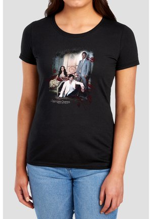 Black fitted t-shirt with graphic of three Vampire Diaries characters: two men and one woman in formal attire and decorative red swirls.