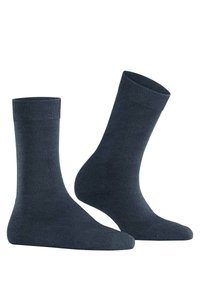 Calzini in cotone grigio scuro con bordo a coste, lunghezza fino al polpaccio, texture liscia e senza motivi o loghi visibili.