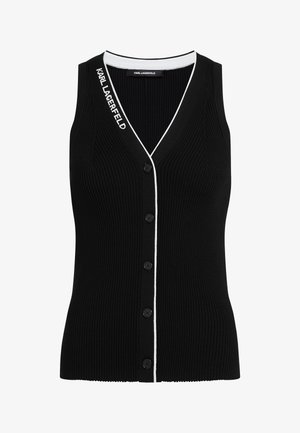 Mustast soonikangast top, millel on V-kaelus, viis musta nööpi ees ning valged ääred kaeluse ja nööbirivi ääres.