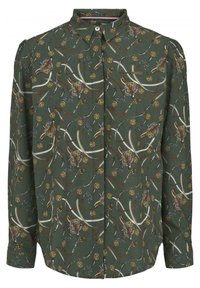 Forest green blouse with a playful pattern of tigers, whips, and golden accents. Features a classic collar and button front. Long sleeves.