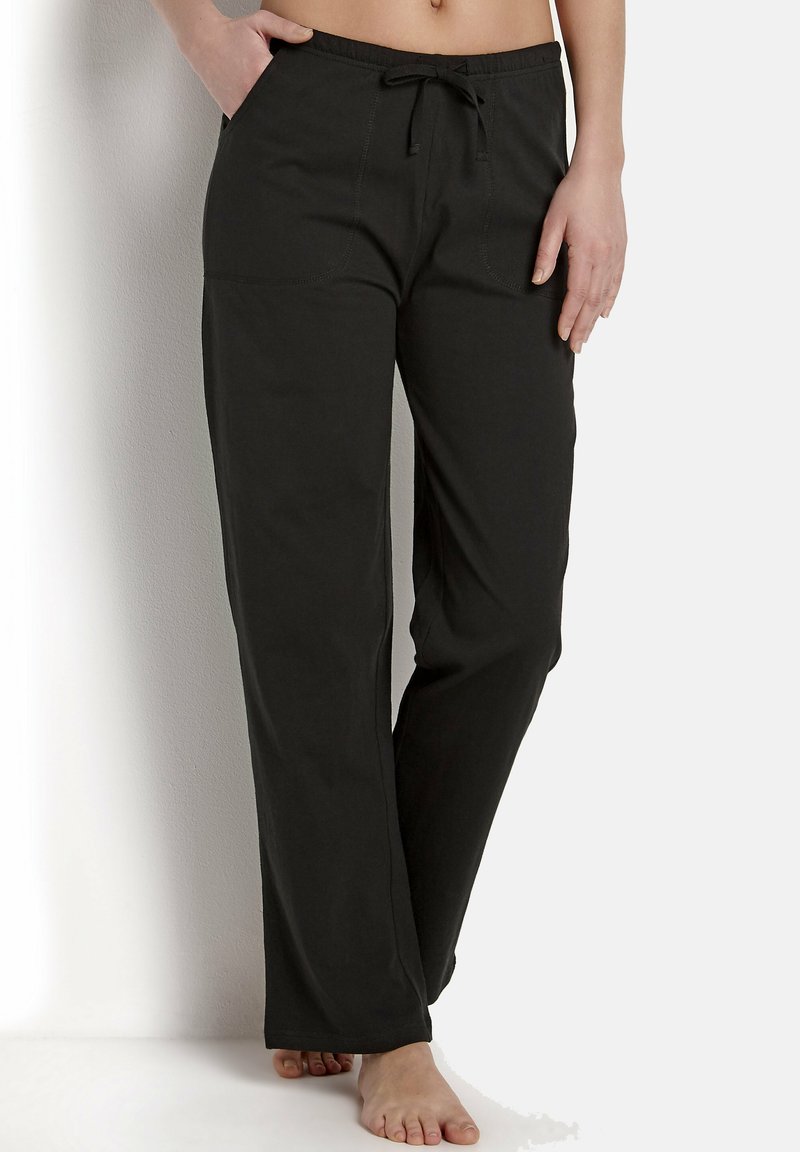 Schwarze, weite Lounge-Hosen mit elastischem Bund und Kordelzug. Mit vorderen Taschen und einer weichen, glatten Textur ausgestattet.