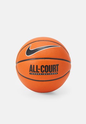Koszulka koszykarska Nike, pomarańczowa z czarnymi akcentami, ma teksturowaną powierzchnię oraz wytłoczony napis "ALL COURT"; zaprojektowana do użytku na boiskach wewnętrznych i zewnętrznych.