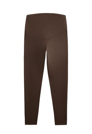 Bruine rekbare leggings met een hoge tailleband, voorzien van een V-vormig ontwerp aan de achterkant en een soepele, matte afwerking.