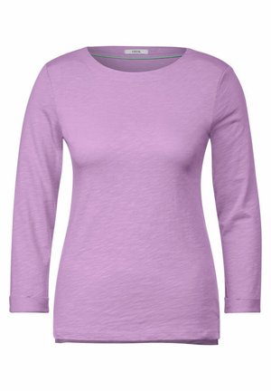 Lilac long-sleeve shirt made of soft, lightweight fabric. Features a round neckline and cuffs. Smooth texture with a subtle sheen.