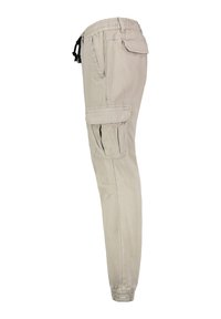 Beige Cargo-Hosen mit elastischem Bund und Kordelzug. Mit Seitentaschen und schmalem Bein-Design. Glatte Stoffstruktur.