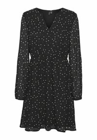 Robe noire en tissu léger, avec un décolleté en V, des manches longues et une taille cintrée, accompagnée d'une jupe fluide ornée de pois.