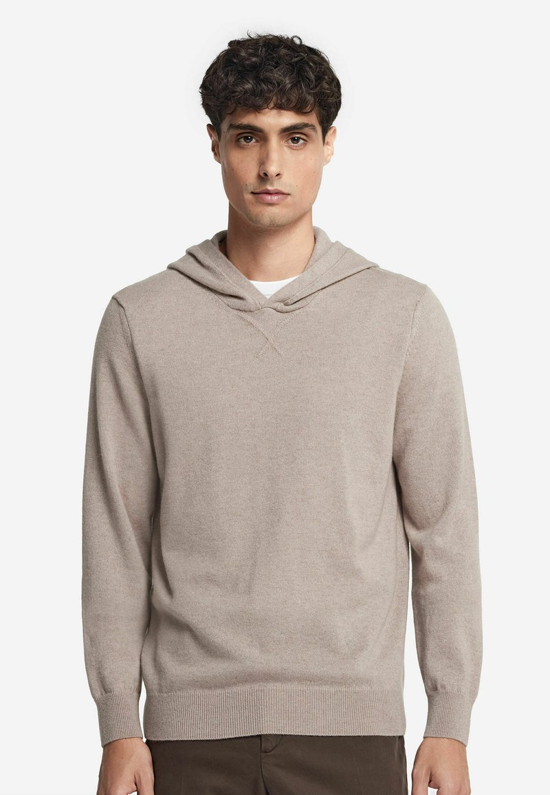 Beige Hoodie aus weichstem Material, mit einer frontalen Kängurutasche, gerippten Bündchen und Saum sowie einer lässigen Passform mit Kapuze und Kordelzug.