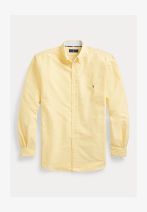 Long-sleeve yellow button-down shirt with collar, front buttons, and small embroidered logo on left chest.