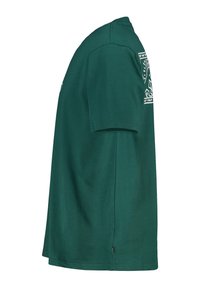 Green cotton t-shirt with a round neckline, short sleeves, and a straight cut. Features a graphic design on the left side.