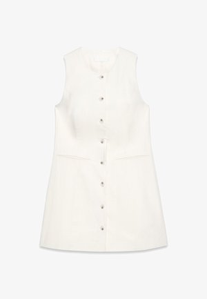 Õlavarre vabalt lõigatud A-line kleit kreemjas linases riidis, millel on nööpidega etteosa, kaks küljetaskut ja jäik kaelus. Sile tekstuur.