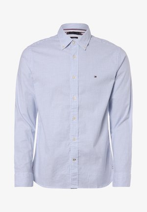 Overhemd met knopen, blauw-witte strepen. Heeft een kraag, een afgeronde zoom en het Tommy Hilfiger-logo op de borst. Gemaakt van katoen.