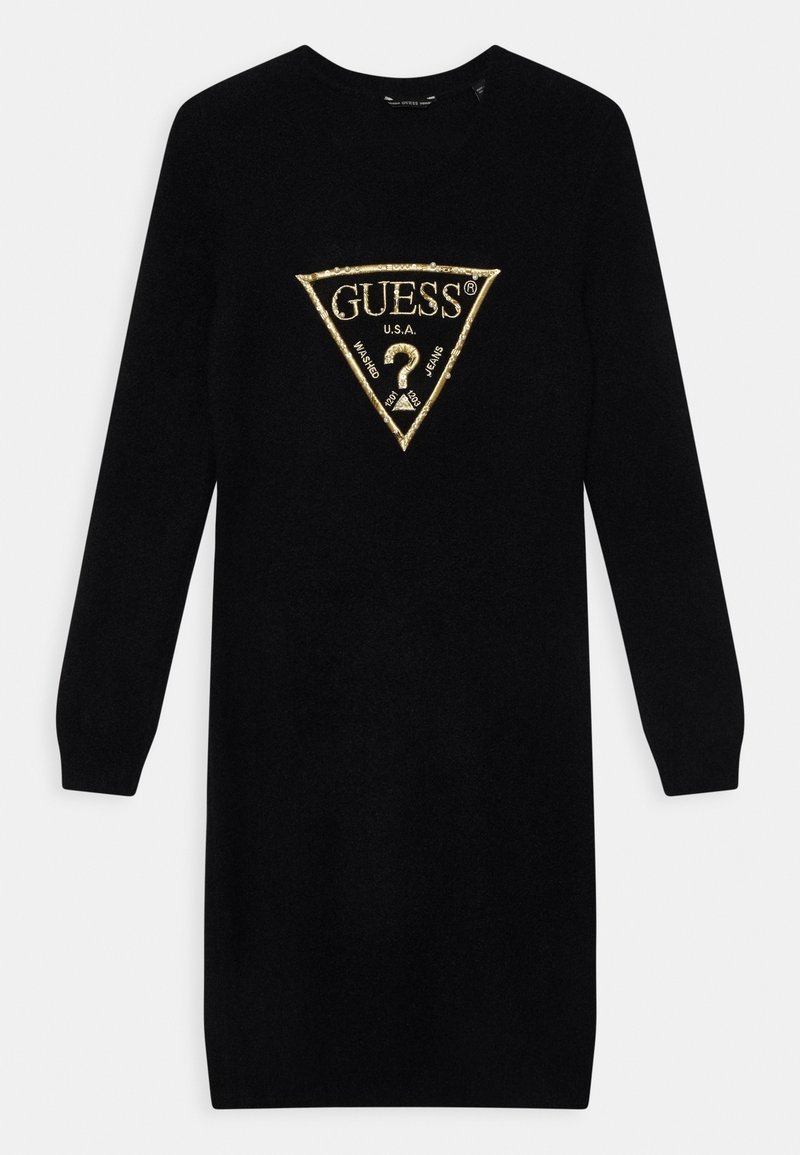 Robe en maille noire à manches longues avec un logo triangulaire Guess orné de bordures dorées et le texte "GUESS U.S.A. Washed Jeans" centré sur la poitrine.