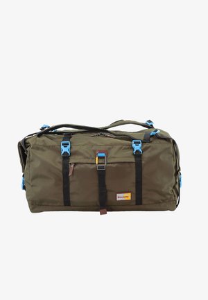 Olive green duffel bag with blue buckles, black straps, and a front pocket. Features a logo patch and top zipper closure. Durable fabric.