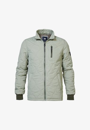 Prošívaná bunda v světle zelené barvě se stojáčkovým límcem, předním zipem a náprsní kapsou. Má elastické manžety a hladkou texturu.