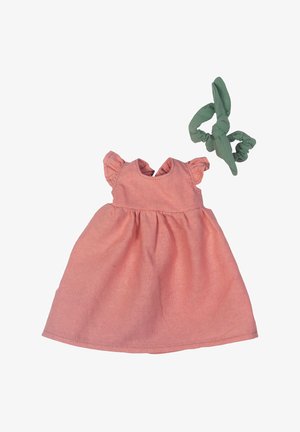 Pink cotton dress featuring a flared skirt, ruffled sleeves, and a v-shaped neckline, paired with a green fabric scrunchie.