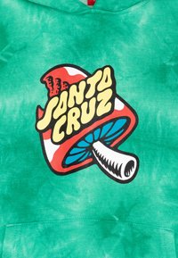 Green tie-dye hoodie featuring a large graphic of a red and white mushroom with the text "SANTA CRUZ" in bold yellow font.