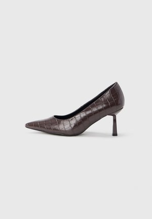 Brown faux leather pointed-toe heels with a crocodile texture, featuring a slim, angular heel and a smooth interior lining.