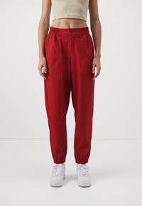 Jordan CORE - Pantalones deportivos - dune red