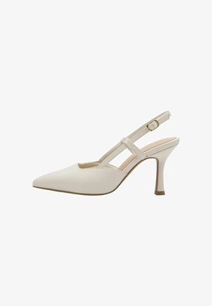 Décolleté slingback in pelle sintetica beige con punta appuntita, sottile cinturino alla caviglia e tacco a spillo slanciato. Dettaglio tacco piatto alla base.